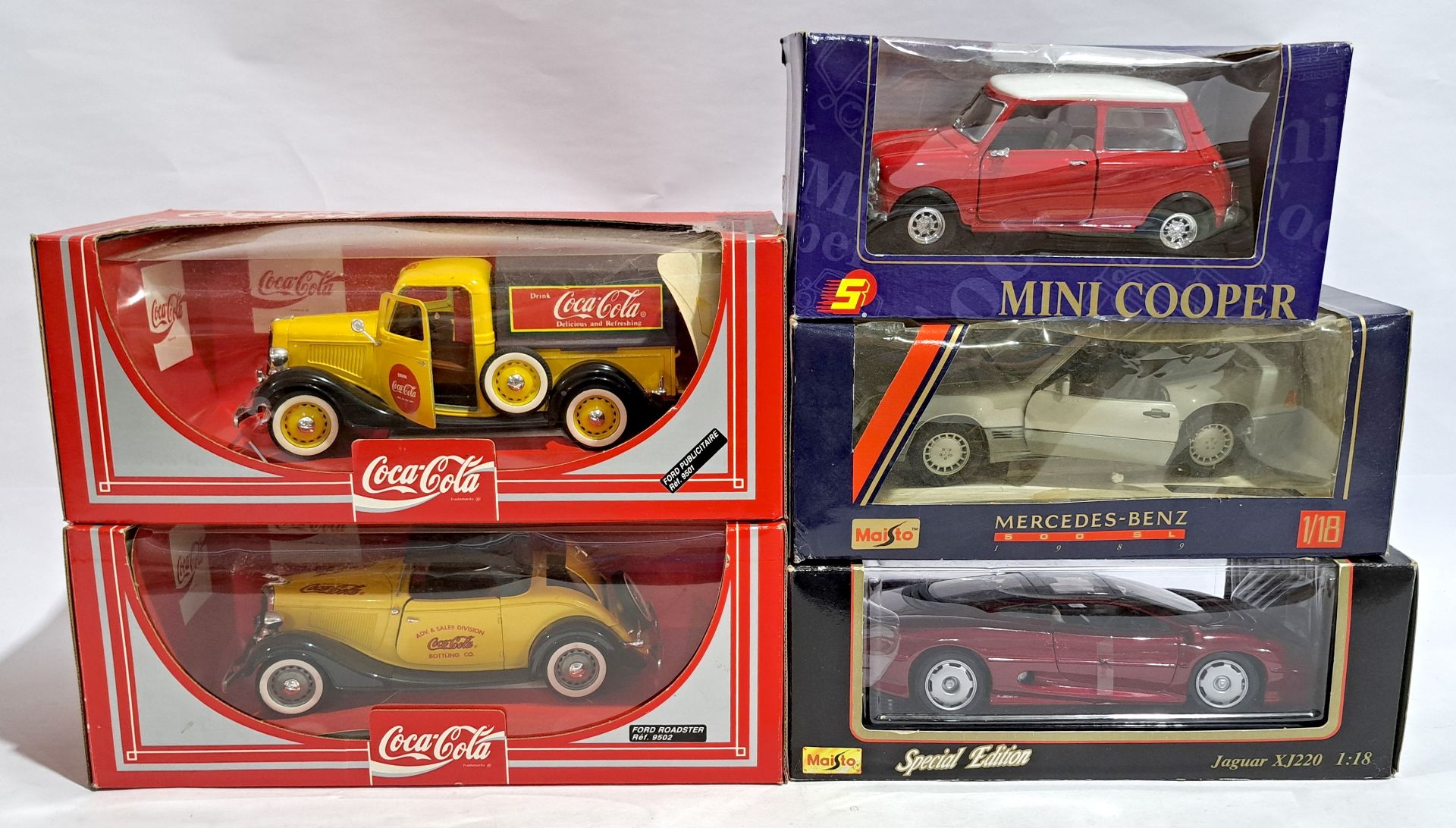 Maisto 1:18 scale & similar, a boxed group of vehicles