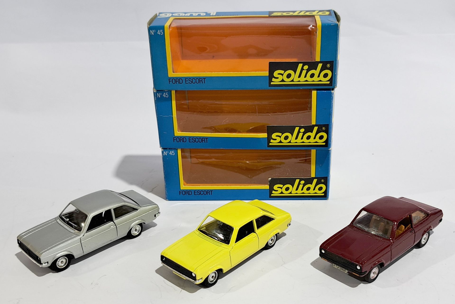 Solido Ford Escort, Silver Yellow & Burgundy, a boxed 1:43 group