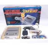 Super Nintendo, a boxed STARWING FX Entertainment System