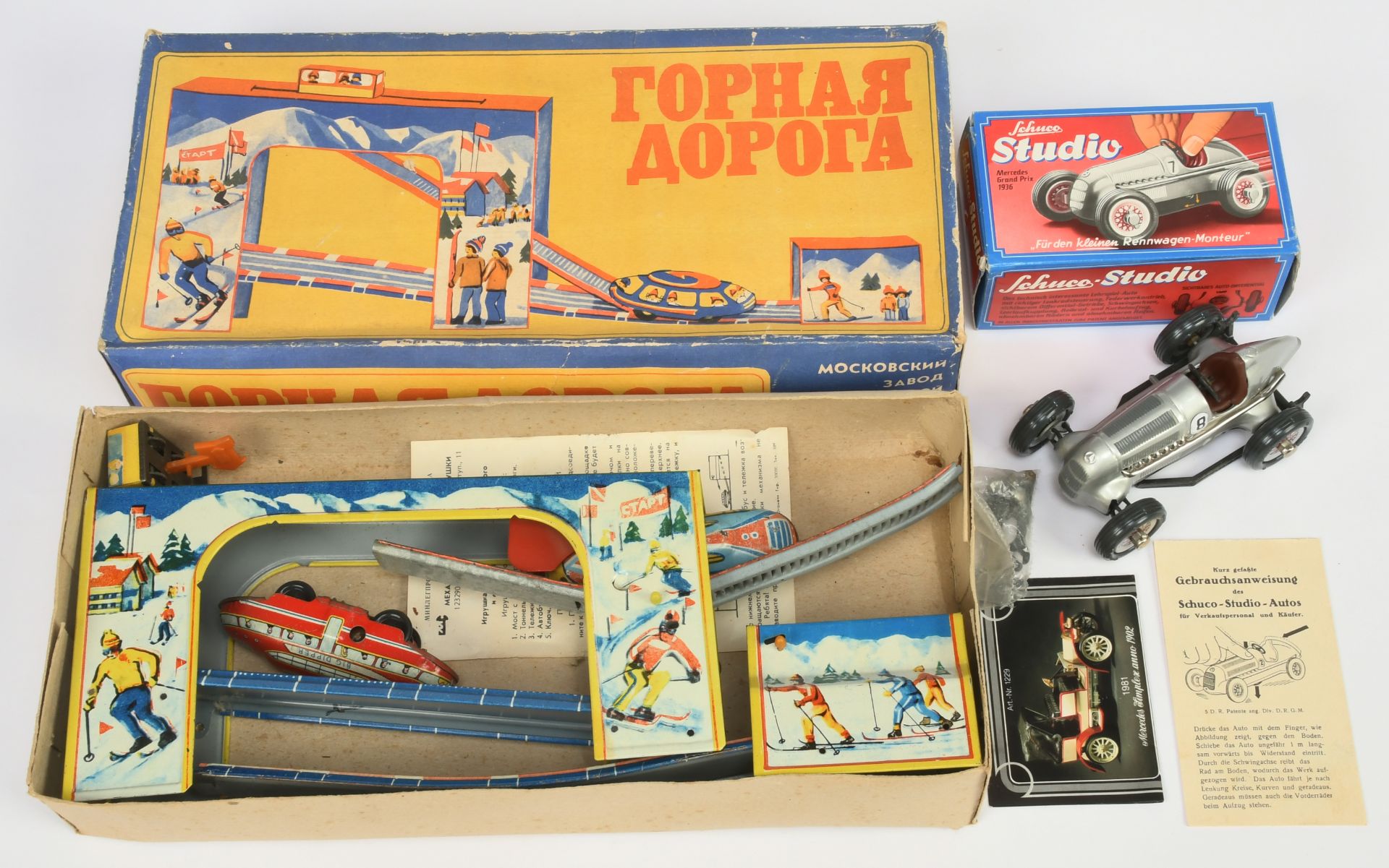 Tinplate Pair - (1) Schuco Re-issue Studio Mercedes Racer - Near mint in a Excellent box and (2) ...