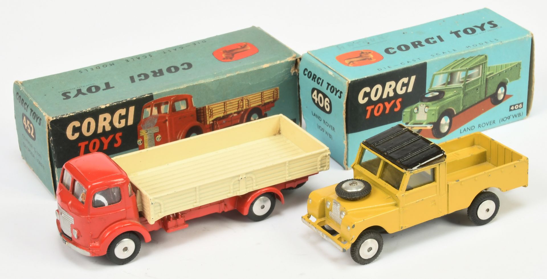 Corgi Toys A Pair - (1) 406 land rover - Yellow body, black ribbed roof, silver trim, flat spun h...