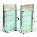 Cabinets A Pair Of Revoking Cases Finished in Silver with 4 X perspex shelf's and front on both s...