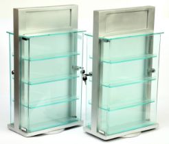 Cabinets A Pair Of Revoking Cases Finished in Silver with 4 X perspex shelf's and front on both s...