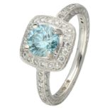 18K White gold shoulder ring set with approx. 0.97 ct. blue diamond and engraved details.