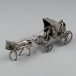 Miniature horse and carriage silver.