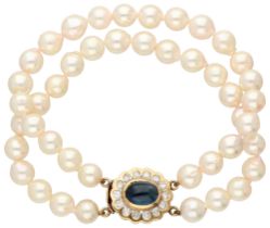 Two-row cultivated pearl bracelet with 14K yellow gold closure set with natural sapphire and diamond