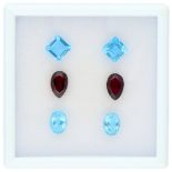 No Reserve - Lot of six natural gemstones consisting of sky blue topaz and garnet.