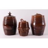 Three various brown glazed Frisian earthenware tobacco jars with lids, 19th cent