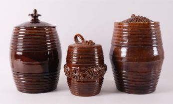 Three various brown glazed Frisian earthenware tobacco jars with lids, 19th cent