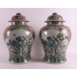 A pair of baluster-shaped famille verte covered vases, China, 20th/21st century.