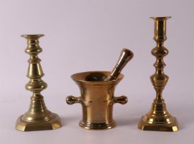 Two various brass one-light candlesticks + bronze mortar, 19th century