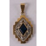 An 18 kt gold Art Deco pendant with a diamond-cut blue sapphire.