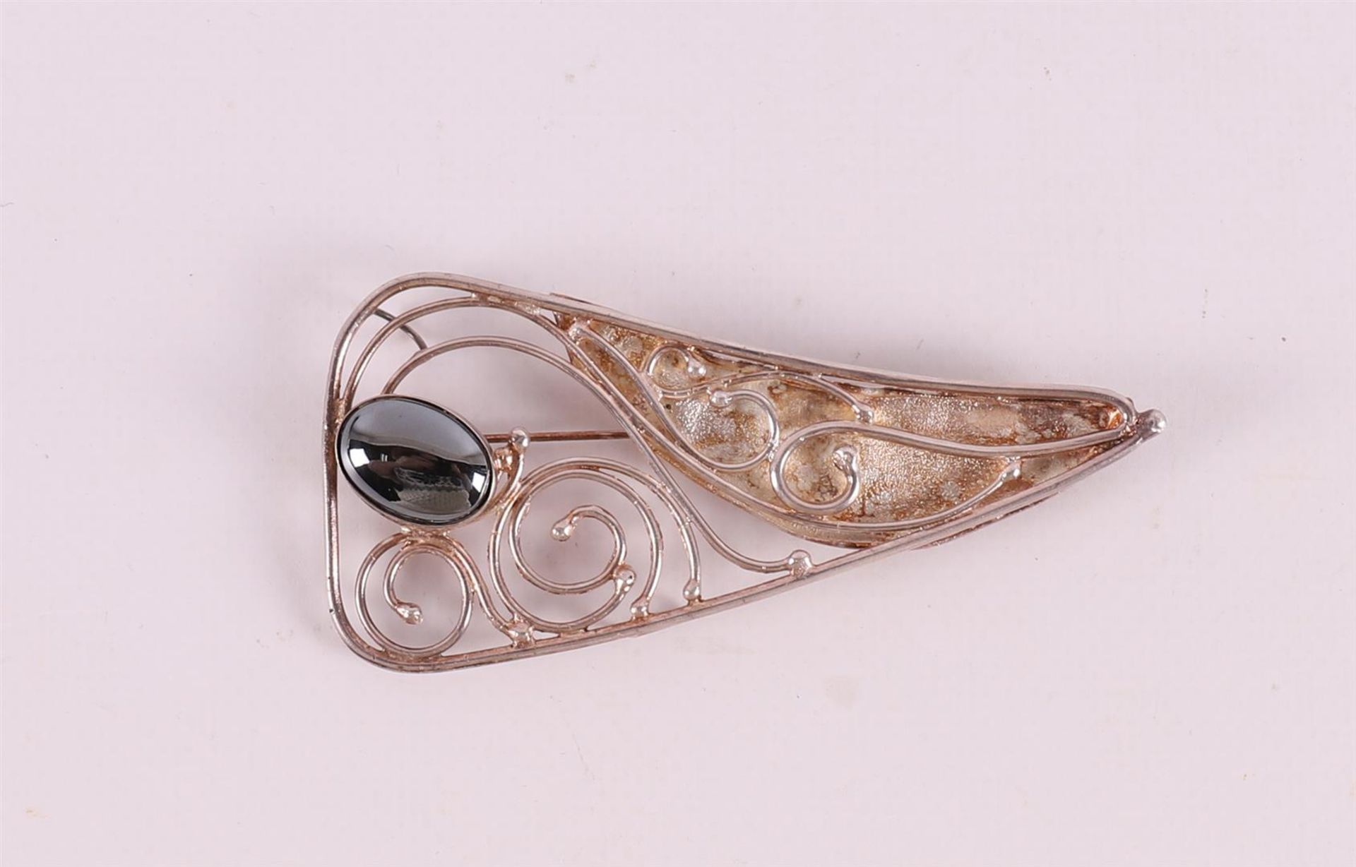 A silver designer brooch, set with faceted hematite, Avi Stoffer, Israel