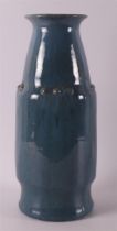 A blue glazed earthenware vase with pearl edge decoration, early 20th century.