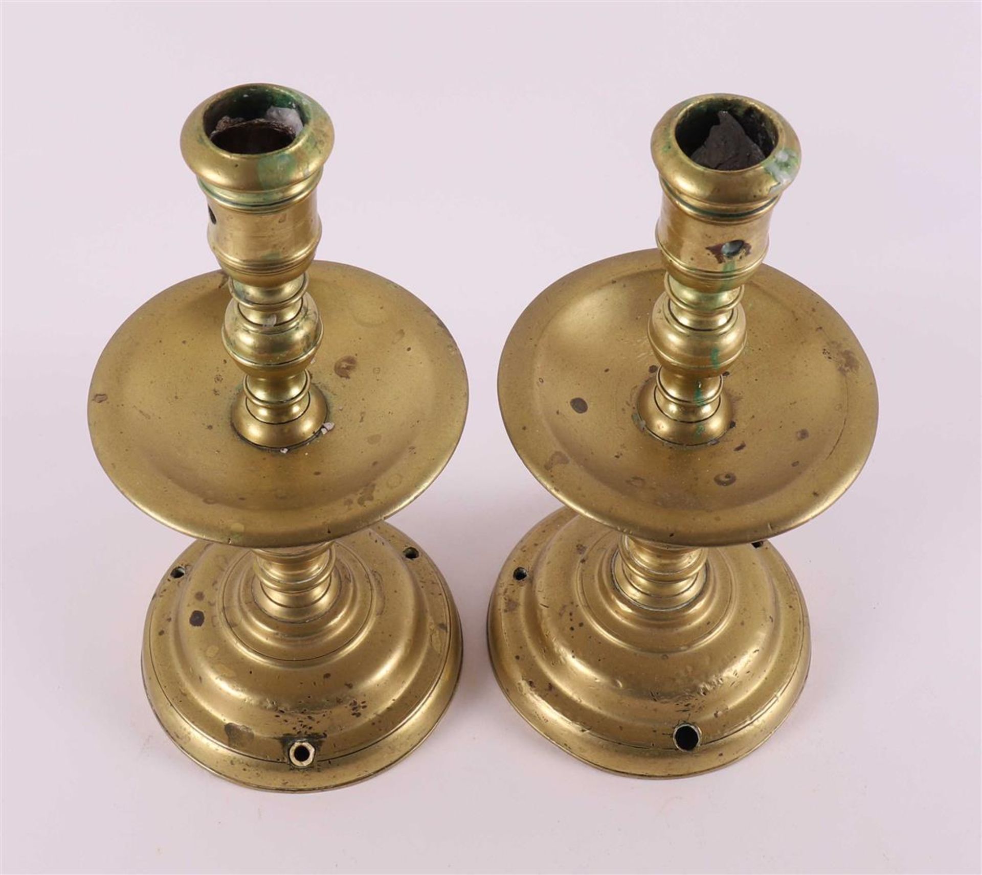 A pair of bronze collar candlesticks, 17th century. - Image 4 of 4