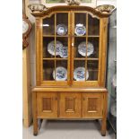 A two-door display cabinet, early 20th century.