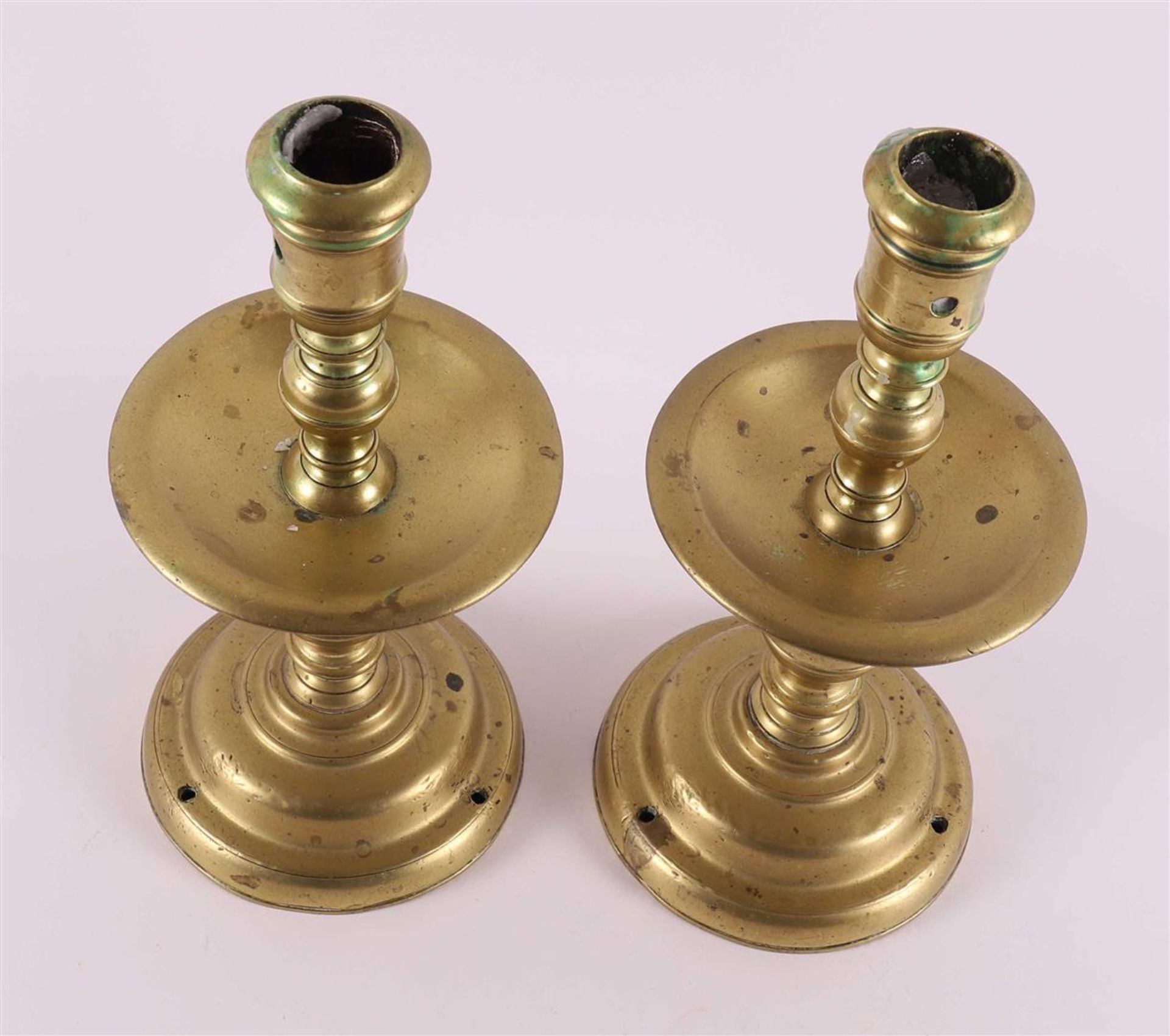 A pair of bronze collar candlesticks, 17th century. - Image 3 of 4