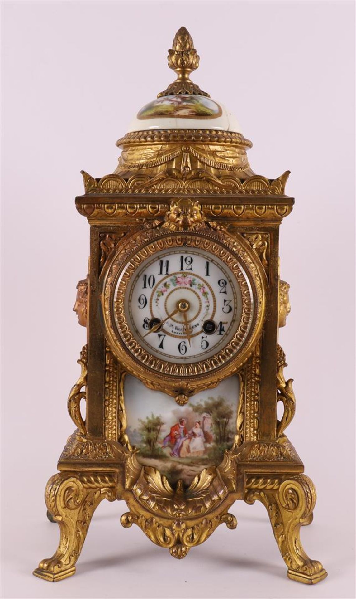 A mantel clock in gilt composite metal casing, late 19th century.