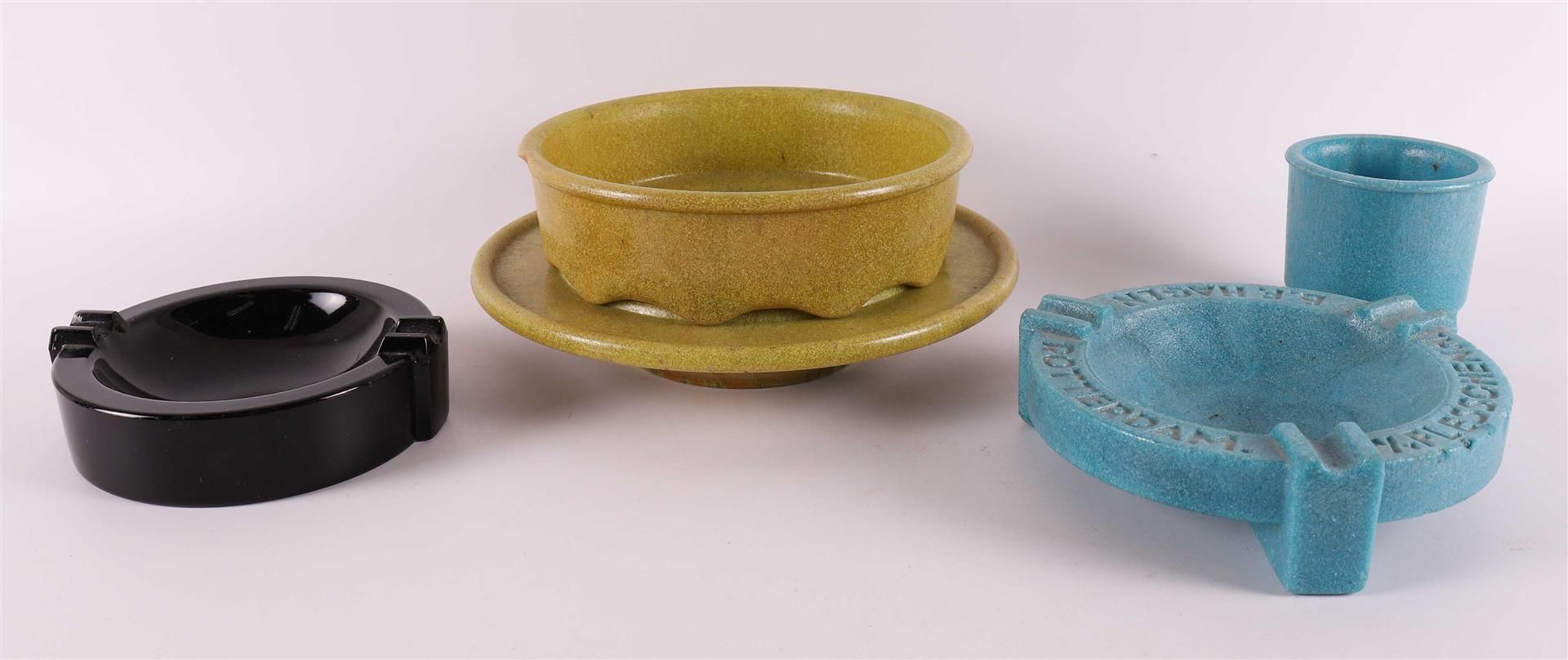 A yellow graniver cactus bowl on matching saucer, 1928. A.D. Copier.