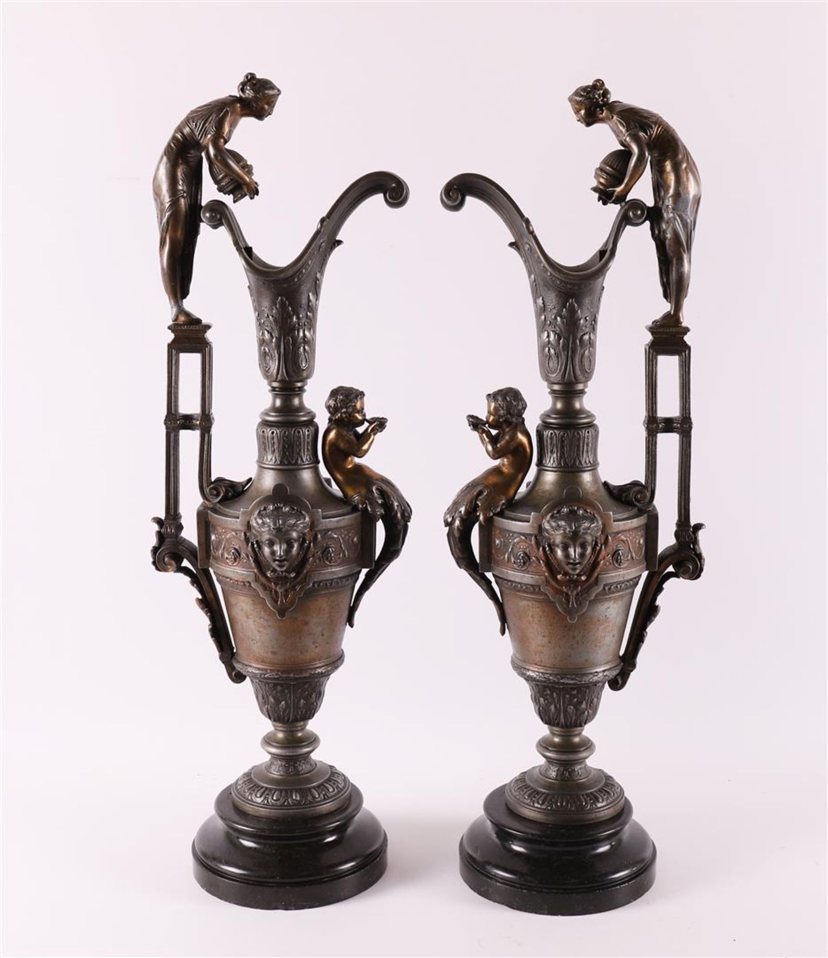 A pair of white metal decorative vases, ca. 1880.