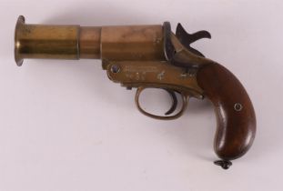 A bronze 'One Inch Brass Flare Pistol', model Mark III, England.