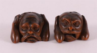 Two carved fruitwood netsuké, Japan, around 1900.