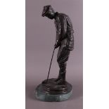 A bronze golfer on a green marble base, after an antique example, 20th century
