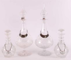 A pair of clear crystal baluster-shaped decanters, 20th century.