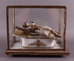 A wax doll in a glass display case, devotionals, 1st half of the 20th century
