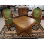 An Amsterdam school dining table and associated salon chairs, ca. 1920.