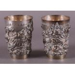 Two silver cups with relief decoration of dragon with flaming pearl, China