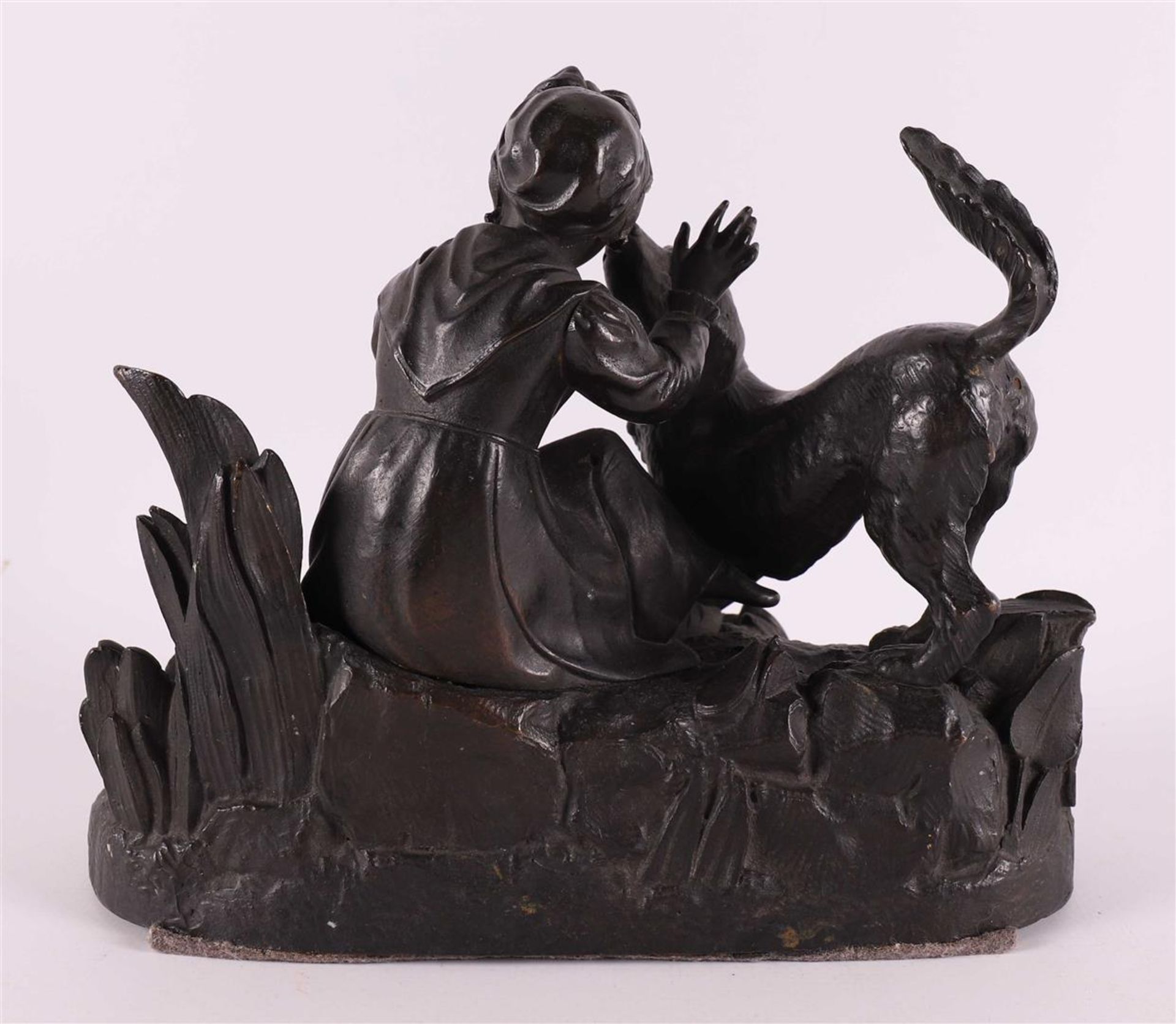 A bronze sculpture of a sitting girl with a dog, around 1900. - Image 2 of 5