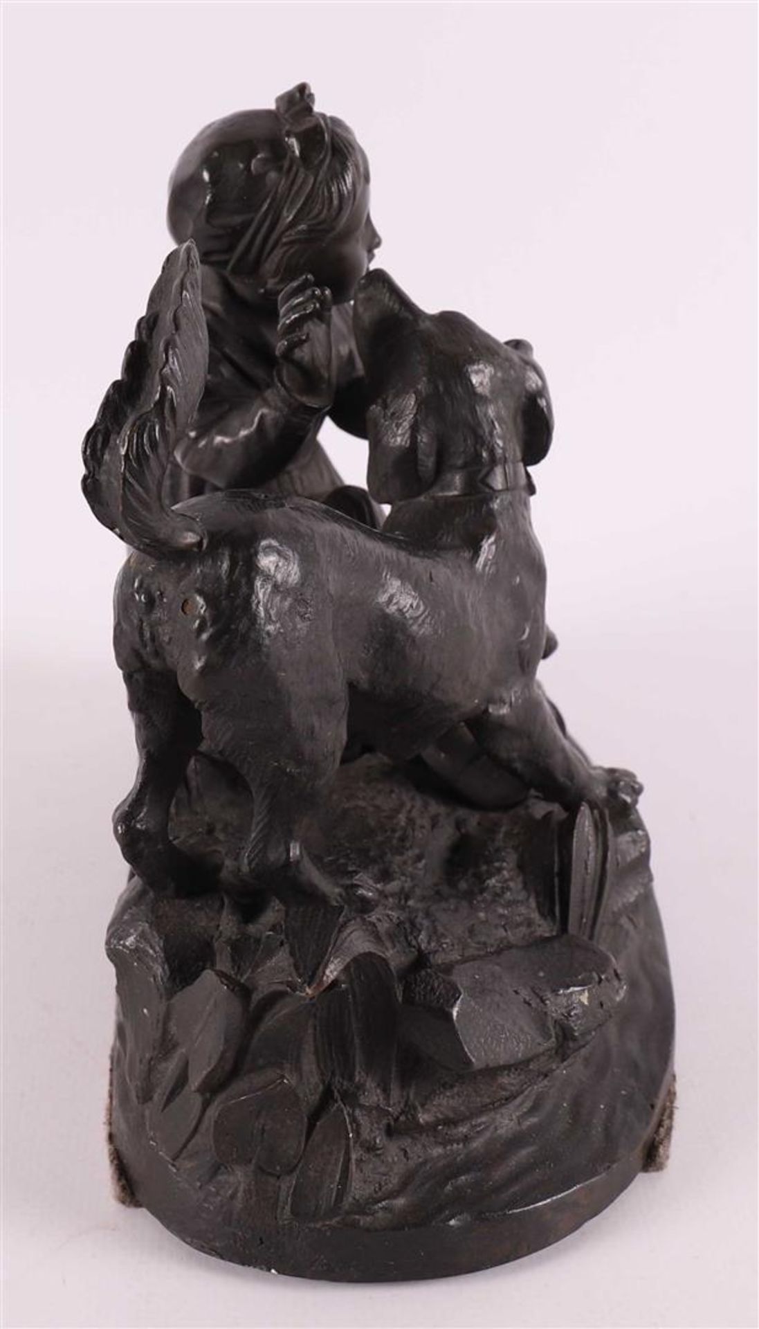 A bronze sculpture of a sitting girl with a dog, around 1900. - Image 3 of 5