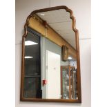 A Soester mirror in walnut frame, around 1900.