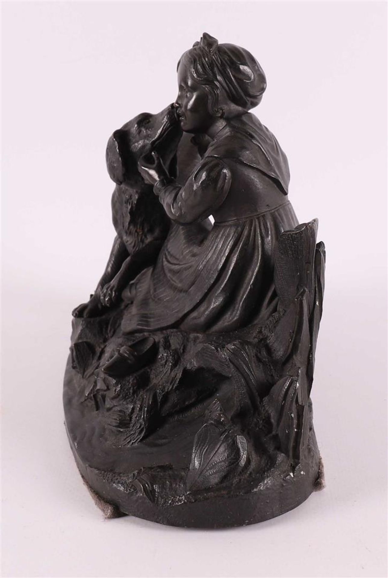 A bronze sculpture of a sitting girl with a dog, around 1900. - Image 4 of 5