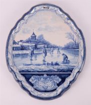 A blue/white pottery Makkums pottery plaque, around 1900.