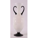 A white glass Art Deco vase with black glass handles and base, France, ca. 1920