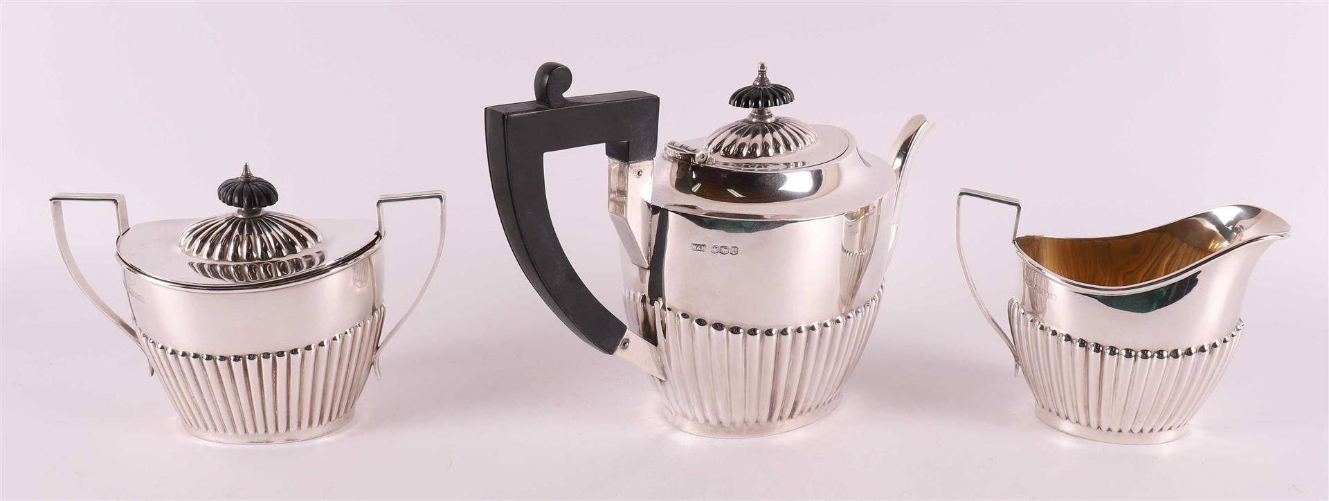 A silver teapot with sugar lid and milk jug, England, Sheffield, - Image 3 of 3