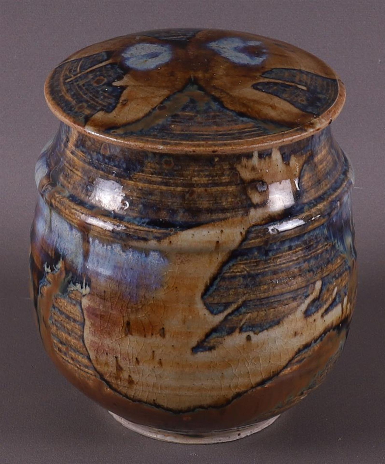 A brown and blue glazed earthenware lidded jar, Han Boerrichter (1935)