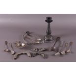 A lot of various silver, including tea strainer and spoons.