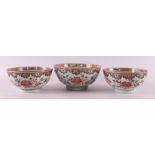 Three famille rose porcelain bowls on stand ring, China, Qianlong, 18th century.