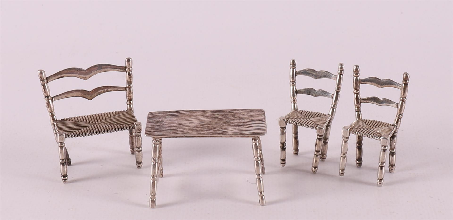 Etagere silver. A table with two chairs and a sofa, 20th century.