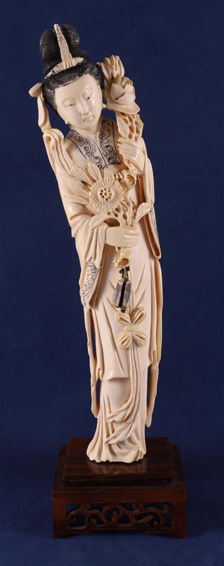 A carved ivory Guanyin, so-called immortal 'He Xiangu', China, Guanxu