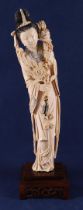 A carved ivory Guanyin, so-called immortal 'He Xiangu', China, Guanxu