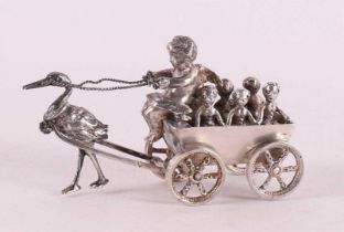 A silver wagon with putto as driver as a deliverer of children, 20th century.