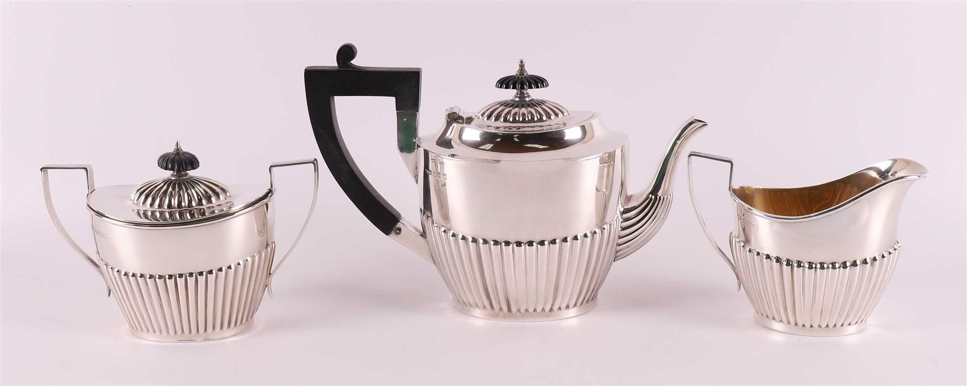A silver teapot with sugar lid and milk jug, England, Sheffield, - Image 2 of 3