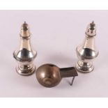 A second grade 835/1000 silver stem tea strainer and two silver shakers