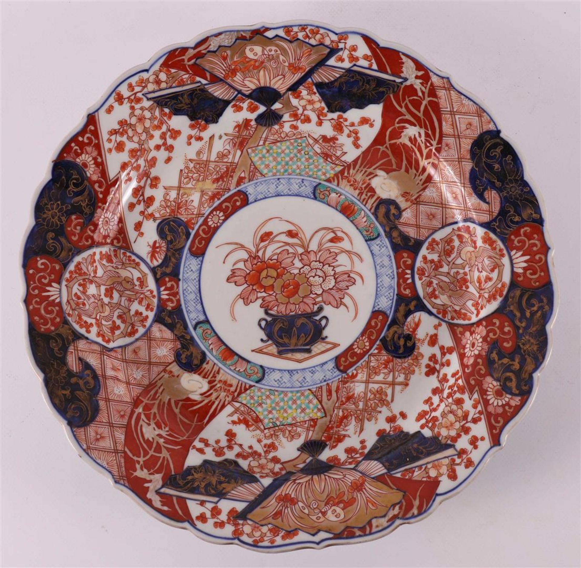 A contoured porcelain Imari dish, Japan, Meiji, late 19th century.