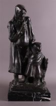 A brown patinated bronze woman with girl and goat, 1907.