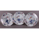 A series of three porcelain famille rose plates, China, Qianlong, 18th century.